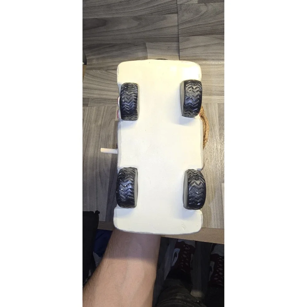 decorative birdhouse styled like a vintage camper van